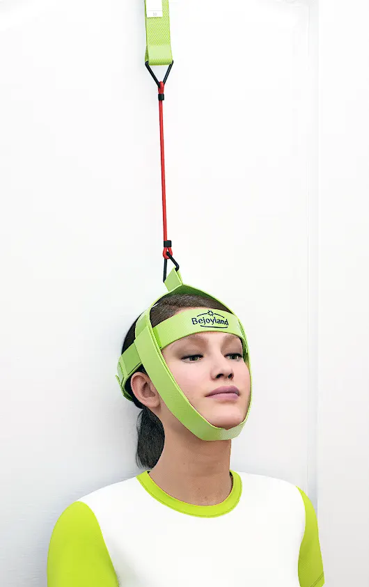 Woman performing the neck flexor stretch, one of the best stiff neck stretches, using the Bejoyland NECKY adjustable neck trainer